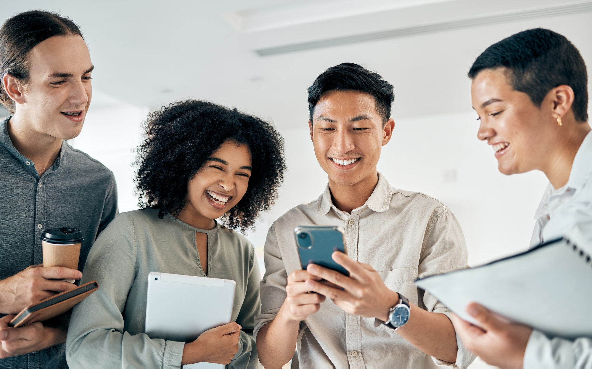 Group of friends looking at a phone together